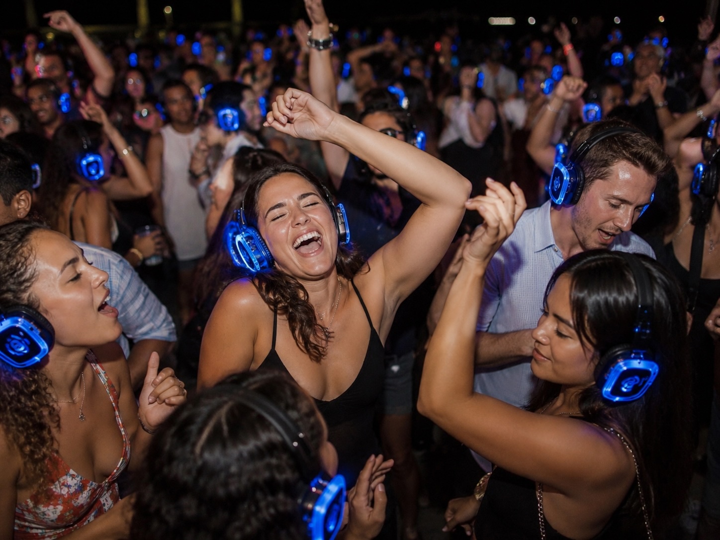 People dancing with silent disco headphones